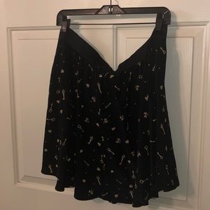 Black skirt with mauve detail print, also has mauve lace underskirt